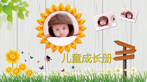 Modèle PPT d'album de croissance pour enfants mignons avec fond d'herbe et de fleurs